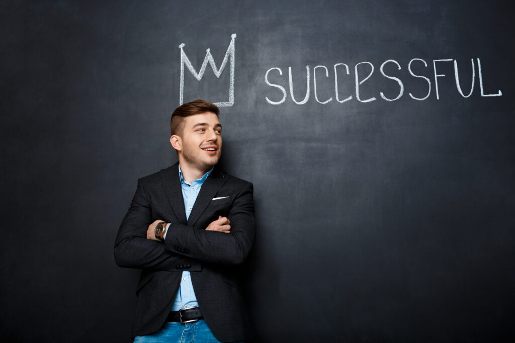 The Entrepreneurial Mindset Behind Long-Term Business Success 6 picture man blackboard with crown text successful.jpg